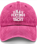 Front view of rose red "No Crying On The Yacht Funny Golf Hat For Men And Women Distressed Washed Baseball Cap Cool Cap For Her Casual All Season Wear Great Gift For Golf Lovers And Beach Day Adventures"