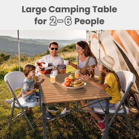 Family enjoying meal at 46.4 Inch Large Camping Table For Two To Six People Beefy Built Heavy Duty Foldable Aluminum Table