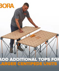 Person assembling Centipede Work Stand Table Top for Portable Workbench 24 by 48 inches with wood top and 20mm dog holes.