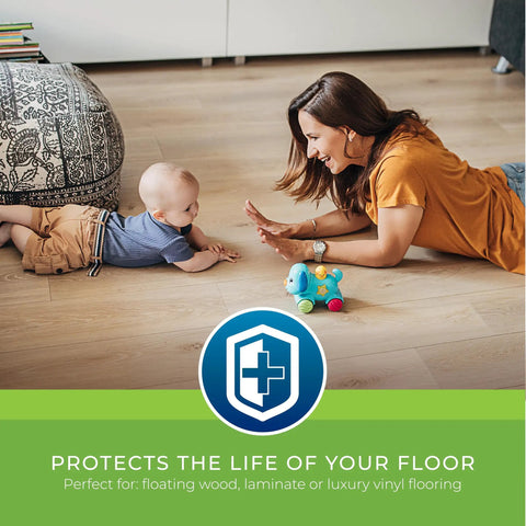 Mother and baby playing on laminate floor with Rock Solid.006 Mil Polyethylene Moisture Vapor Barrier Roll for protection.