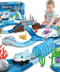 Child playing with blue Shark Race Track Set With Bendable Cars For Kids Aged 3 To 9, 183 Piece Ocean Themed STEM Playset