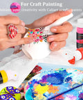 Hand painting a ceramic vase with Acrylic Paint Set With 36 Dope Rich Pigment Colors, 2 Oz Bottles, Includes 12 Brushes.