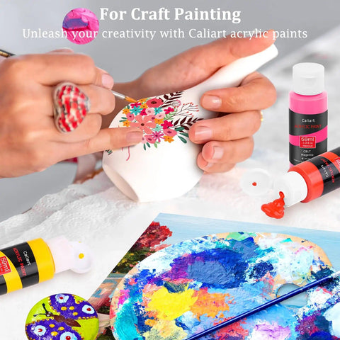 Hand painting a ceramic vase with Acrylic Paint Set With 36 Dope Rich Pigment Colors, 2 Oz Bottles, Includes 12 Brushes.