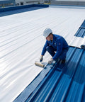Self Adhesive Waterproof Roofing Roll, Hella Tough Self Stick Underlayment, installation on metal roof with a worker using a roller.