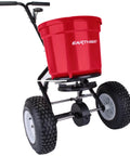 Heavy Duty 50 Lb Broadcast Fertilizer Spreader For Lawns, Walk Behind Push Seeder, shown with large 13 inch pneumatic tires.