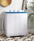 No Sweat Compact Twin Tub Washer And Spinner Combo Portable 20 Lb Heavy Duty Laundry Machine in a stylish room with plants.