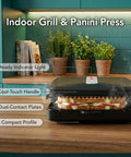 Ovente Two Serving Electric Indoor Grill And Panini Press Compact Contact Maker For Juicy Steaks Bold Smoky Flavor No Outdoor Mess Black Kitchen Appliance, showing cool-touch handle and dual-contact plates.