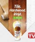 Showroom Ready Hella Glossy Floor Polish And Restorer With High Gloss Wax Coating That Fills Scratches And Brings New Life To Dull Hardwood Laminate Vinyl Tile And Marble Surfaces Today on a bottle with wood and tile surfaces in background.