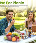 Clear Plastic Stackable Fridge Storage Bins 8 Pack Pantry Organization Cubes for Grocery Management used at a picnic with fruits.