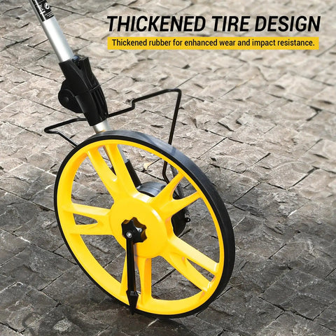 Digital Measuring Wheel With 12.5 Inch Wheel, Pro Grade Precision, Switchable Feet And Meters On Digital Display, Folding Roller With Storage Bag For Quick Distance Readings At Worksites And DIY Projects. yellow digital measuring wheel with thickened rubber tire on stone pavement