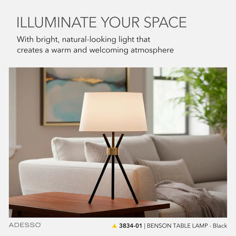 Benson Tripod Floor Lamp, 60 Inch Tall, Black With Antique Brass Accent, Drum Linen Shade, CFL Equivalent, on a table in room