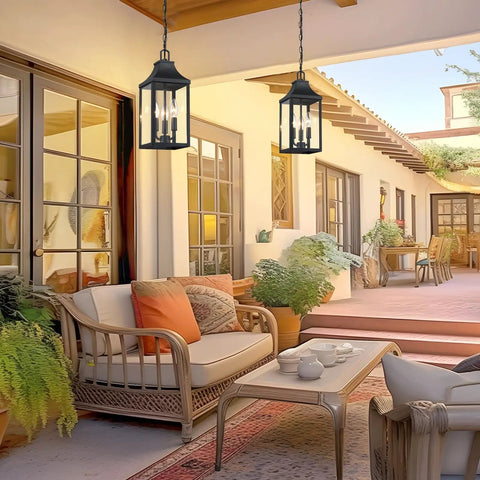 Badass Matte Black Outdoor Pendant Lighting Three Bulb Exterior Hanging Porch Fixture With Clear Glass Shades in a cozy patio setting.
