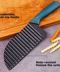 Front view of teal-handled crinkle cutter with ribbed stainless blade for vegetables.