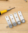 Buttery Smooth 4 Pack Sliding Door Pulley Wheels With Silent Rubber Bottom Rollers and Rock Solid Construction for Easy Side Mount Closet Barn Door Track Hardware Replacement, featuring four metal pulley wheels and a screwdriver.