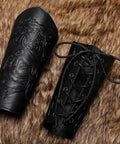Badass Medieval Faux Leather Bracers Featuring Dragon And Viking Embossing, adjustable and laced arm cuffs on fur background.