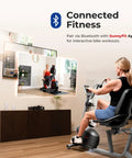 Person exercising on Dope Magnetic Recumbent Bike With Hand Cycle For Full Body Workout, connected to TV app for interactive training
