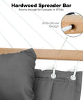 Close-up of a haze gray two person outdoor hammock with hardwood spreader bar, removable pillow, and anti-rollover design.