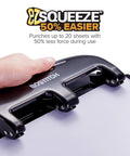 Bostitch 3-hole punch, EZ Squeeze, metal construction; black with silver accents, shown punching a sheet