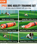 Dogs using Ultimate Dog Agility Course Backyard Set with 13 Pieces, showing weave poles, tunnels, jump bar, and hoops in action.