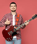 Person showing SnapLock Pro Guitar Strap with Quick Release Buckle and Screw Fasten Ends on electric guitar, orange color.