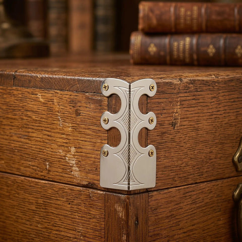 Heavy Duty Metal Corner Protectors Set for Jewelry Boxes Tables and Trunks, antique metal edge guard on wooden corner.