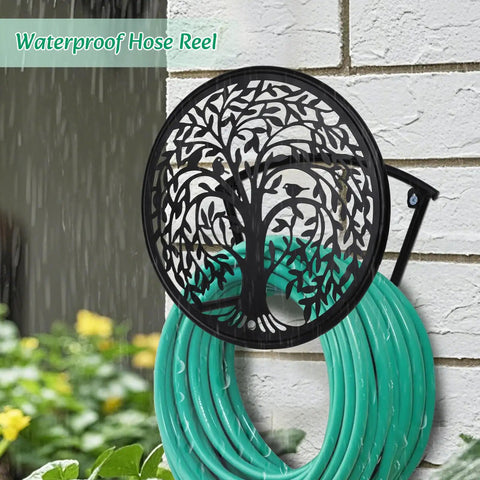 Heavy Duty Outdoor Garden Hose Reel and Wall Mount Holder With Tree of Life Metal Design mounted on a wall with green hose