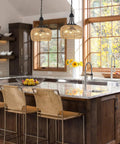 Straight Up Gorgeous Farmhouse Chandelier Featuring Three Woven Rattan Shades hanging in a modern kitchen over a dining island.