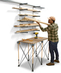 Six Level Wall Mounted Metal Lumber Rack For Garage Organization And Heavy Duty Wood Storage Shelf Pipe Holder Plywood Sheet Stand in use with lumber.
