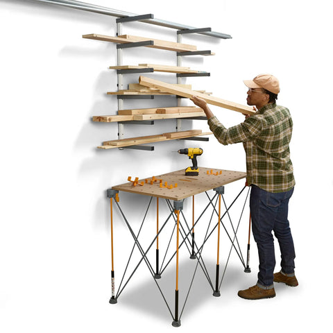 Six Level Wall Mounted Metal Lumber Rack For Garage Organization And Heavy Duty Wood Storage Shelf Pipe Holder Plywood Sheet Stand in use with lumber.