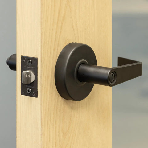 Heavy Duty Lever Style Privacy Door Handle Grade Two Not Keyed With Oil Rubbed Bronze Finish For Commercial Use on a wood door