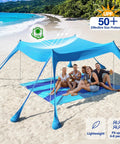 Group relaxing under Beach Tent 10 By 10 Ft Portable Shade Shelter With 8 Sandbags and UPF 50 Plus Sun Defense Sky Blue on beach