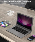 Hassle Free Slick Pop Up Outlet With Wireless Charging Pad And Fast 65W Usb Port 4 Point 7 Inch 20 Amp GfcI Countertop Mount in use with laptop and tablet.