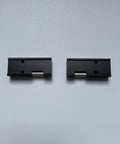 Fujikura 12 Core Ribbon Fiber Holder Chucking Jigs FH-60-12, black durable replacement sheath clamps, two pieces on white background.