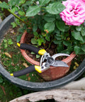 Pro Grade Pruning Shears For Gardening With Non Slip Ergonomic Handles And Blade Cover Sharp Garden Clippers near potted roses
