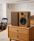 Bookshelf Studio Monitor Speakers 36W RMS Active Bluetooth 5.4 Wireless USB Audio, shown on wooden table, with phone pairing.