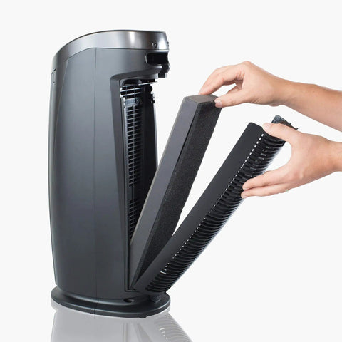 Replacing air filter in T500 Tower Air Purifier, True HEPA Filter that captures particles down to 0.1 micron, showing filter removal