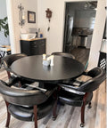 Dining area with black table and chairs, featuring 2 Inch Grip Ring Swivel Ball Caster Wheels for furniture and office chairs.