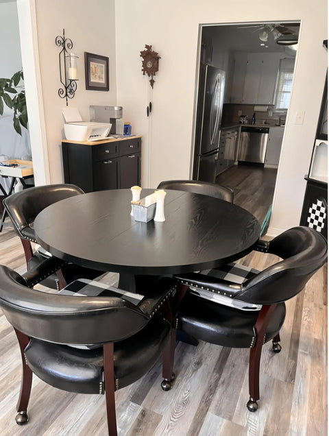 Dining area with black table and chairs, featuring 2 Inch Grip Ring Swivel Ball Caster Wheels for furniture and office chairs.
