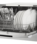 Total Game Changer Compact Countertop Dishwasher In Brushed Stainless Steel, loaded with plates and utensils.