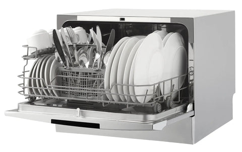 Total Game Changer Compact Countertop Dishwasher In Brushed Stainless Steel, loaded with plates and utensils.