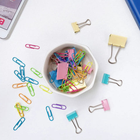 Ceramic Paper Clip Holder With Gold Line Dispenser, Desk Organizer For Paper Clips, Binder Clips, Bobby Pins And Hair Clips, Cute Pink Floral Pattern Gift For Office Decor And Desk Must Have with colorful paper clips and binder clips on a desk.