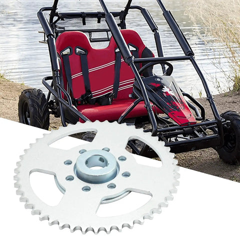 Go Kart Rear Sprocket Kit With 48 Tooth Sprocket, 8 Hole Hub, 1 Inch Bore, Quarter Inch Keyway, shown next to a go-kart