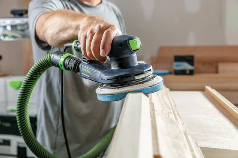 Man using electric sander with Granat Profile Soft 6 Inch Sanding Discs 10 Pack For Contours Curves And Moldings With Flexible Foam Backing