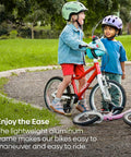 Two kids with helmets and bikes in a park, featuring Go 3 Automagic 16 Inch Kids Bicycle With Automatic Two Speed Shifter Hand Brakes.