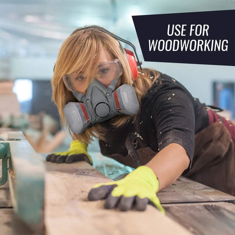 Person wearing a respirator mask with 8-Pack Replacement Carbon Filters For Respirator Masks, Pro-Grade Multi-Layer Cotton Filtration for woodworking.