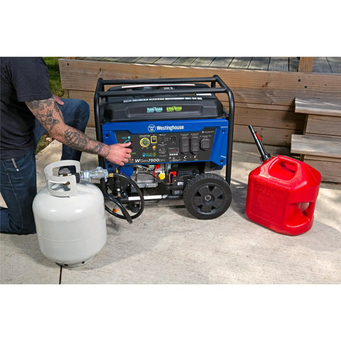 Man operating Dual Fuel Portable Generator With Electric Start And Remote Key Fob, 9500 Peak Watts Gas Or Propane, Transfer Switch Ready