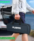 Person carrying travel case of Telescopic Fishing Rod And Reel Combo With 373 Piece Tackle Box by car trunk