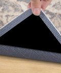 Close-up of corner gripper from 14 Piece Non Slip Rug Tape Set With Rug Grippers And Pad Grippers For Hardwood Floors Tile And Mats.