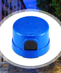 Close-up of Three Pack Photocell Twist Lock Auto On Off Sensor Switch For Outdoor Lighting Dusk To Dawn Light Control, blue weatherproof exterior.