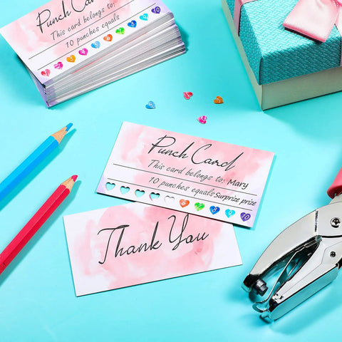 Top Shelf Blank Reward Cards With Zero Hassle Metal Heart Puncher With 100 Pack Hella Thick Coated Cardstock For DIY Crafting Small Biz Loyalty Rewards And Gift Tag Creations displayed with punch tool and colored pencils.